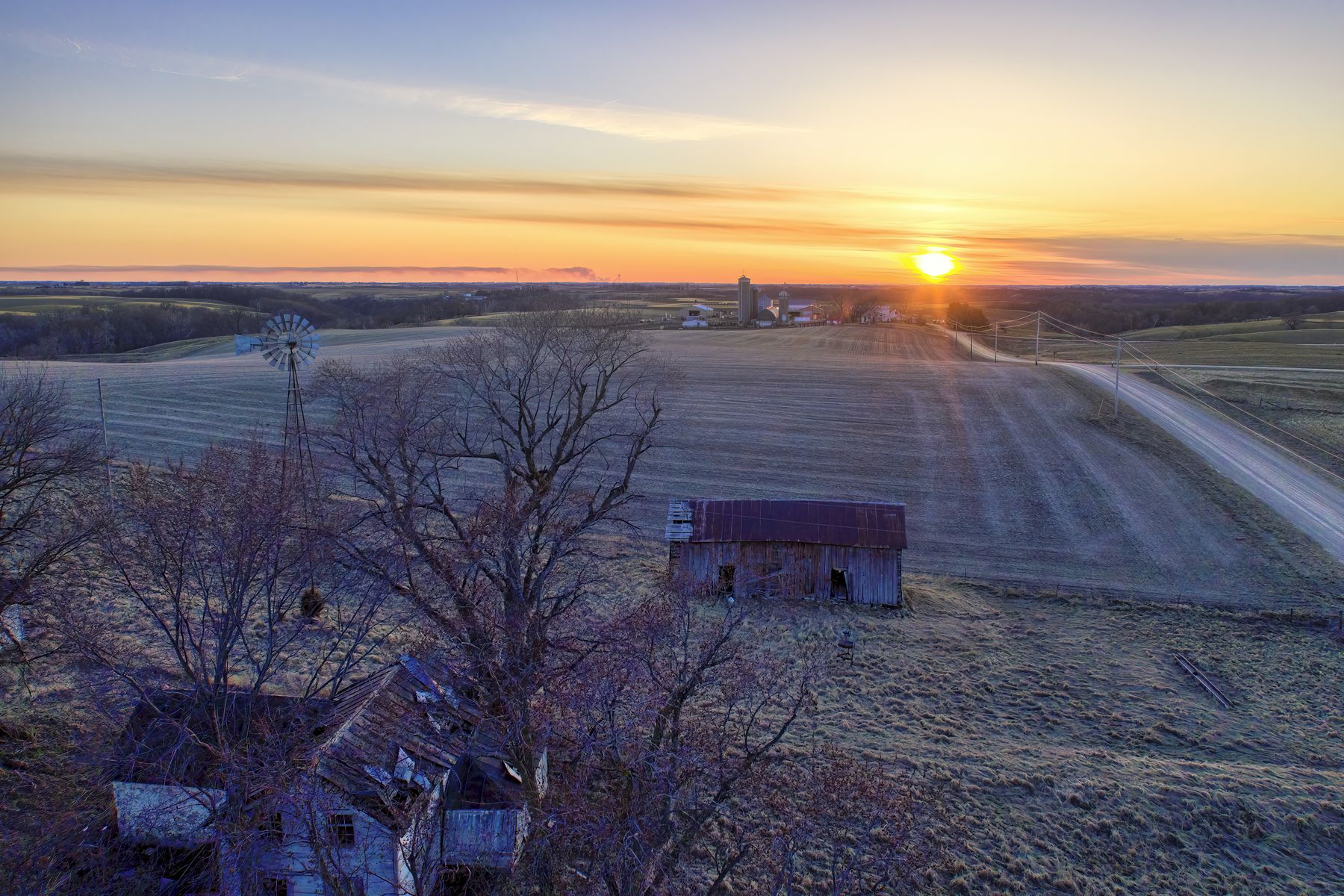 Wide aerial view of prairie landscape at sunset